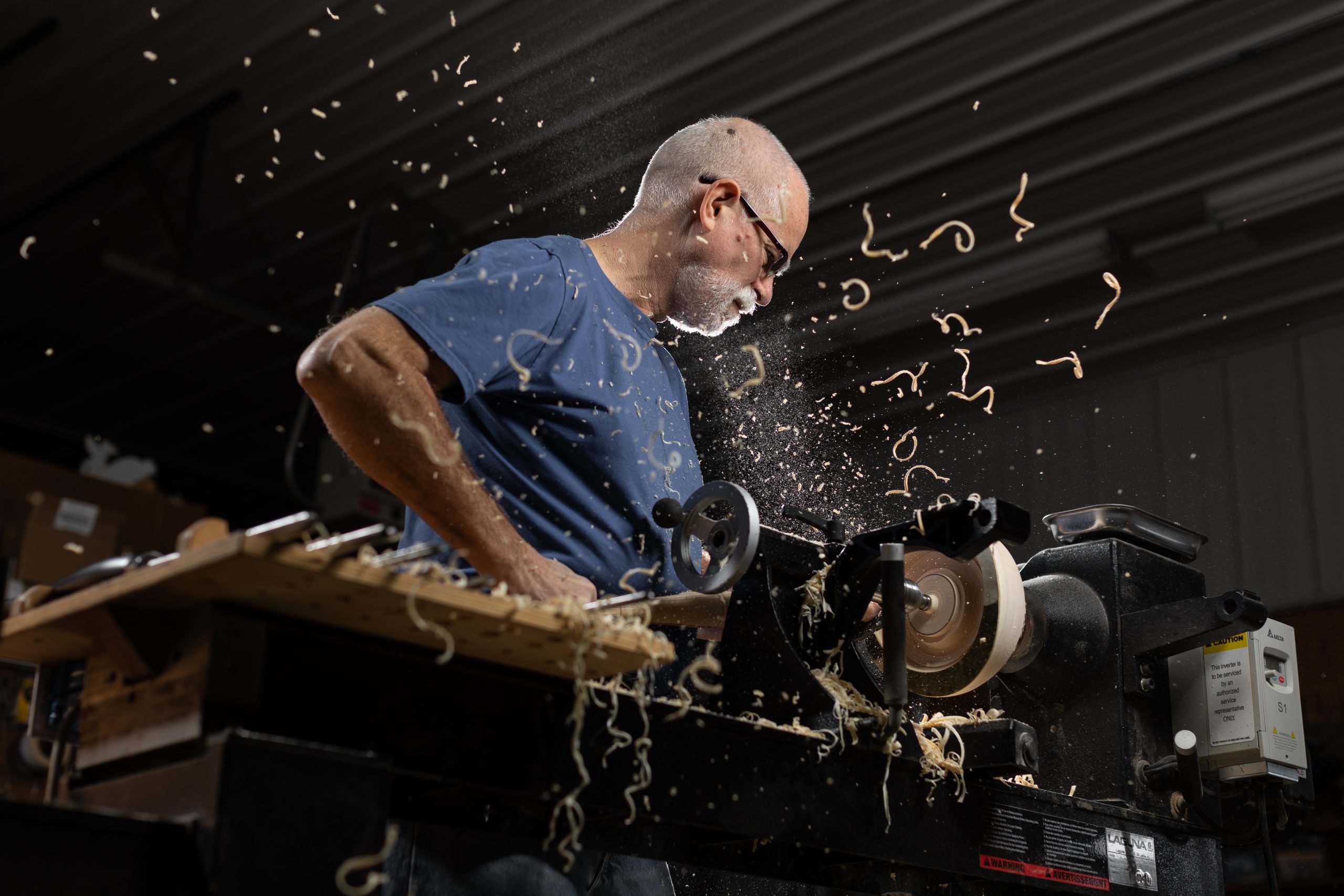 Doug carving wood out of a Sycamore Bowl